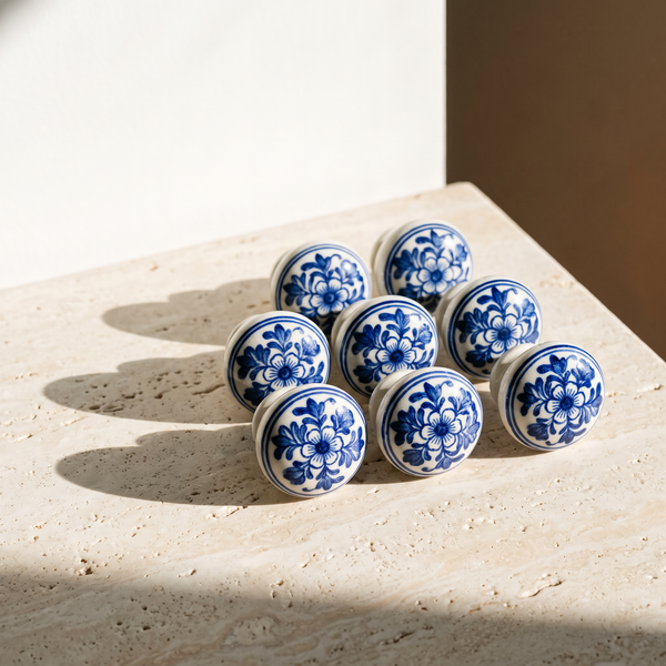 Six cobalt blue pottery knobs arranged on stone